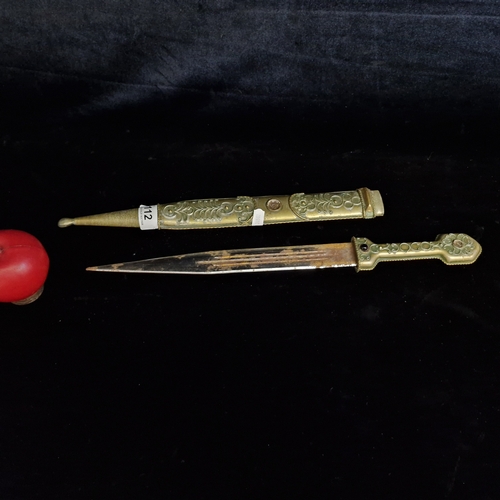 112 - A large antique dagger / sword with Brass handle. Features ornate design throughout with original br... 