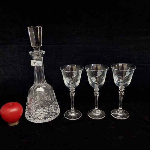 114 - A Waterford Crystal decanter with diamond cut pattern alongside three pretty wine glasses with etche... 