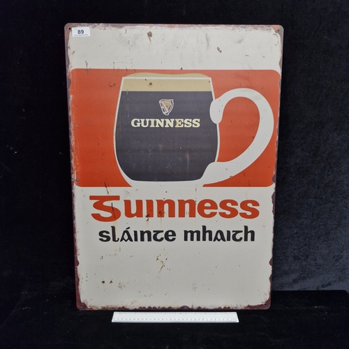 89 - A large printed metal wall sign reading 'Guinness'. MM: 50cm x 70cm. Please note, the image of the m... 