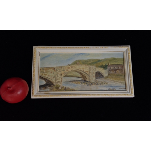 96 - A sweet original oil on board painting featuring landscape with arched bridge. Signed J.M. Evans low... 