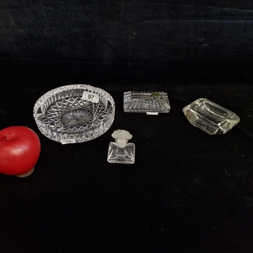 97 - Four cut crystal pieces including a Waterford Crystal paper weight, two ash trays  and a miniature p... 