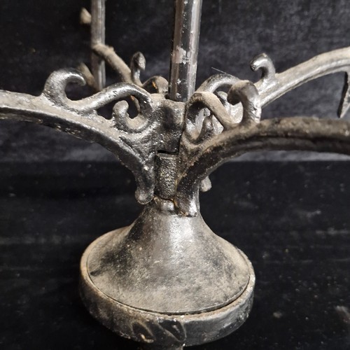 168 - Star Lot : A vintage large wall mounted cast metal garden weather vane depicting a farrier working o... 