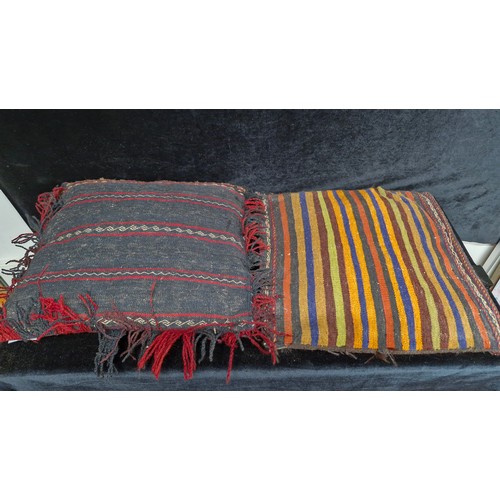 216 - A fascinating hand knotted antique Moroccan camel saddle blanket repurposed into two cushion covers.