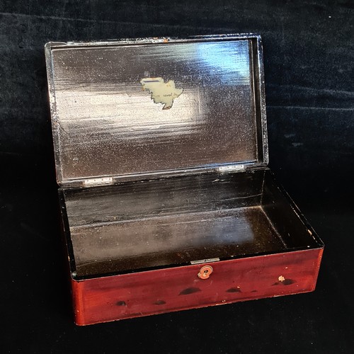 94 - A Japanese lacquered wooden storage box with hand painted gilt accents depicting traditional natures... 