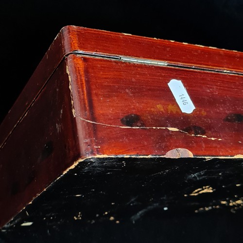 94 - A Japanese lacquered wooden storage box with hand painted gilt accents depicting traditional natures... 