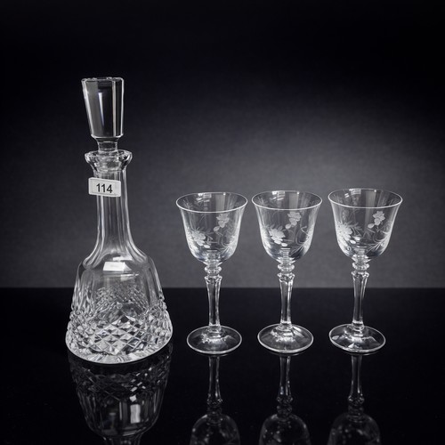 114 - A Waterford Crystal decanter with diamond cut pattern alongside three pretty wine glasses with etche... 