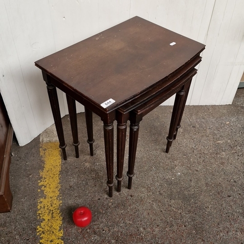 644 - Set of three mahogany finish nesting tables, each with rectangular top above a plain frieze and turn... 