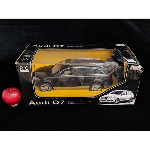 226 - A Rastar Audi Q7 full function radio control model car with a scale of 1/14. Housed in original box.