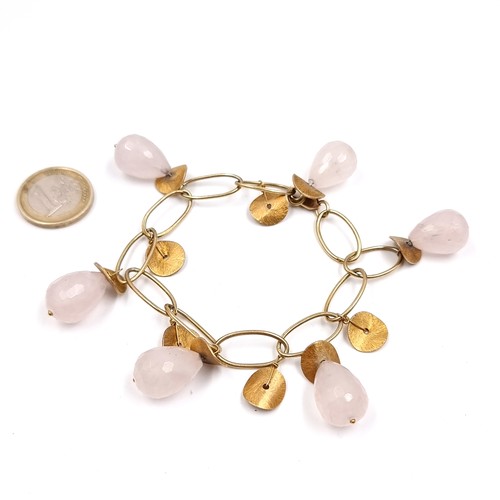 184 - A 1/20 14 carat gold bracelet with pink quartz pear drop charms.