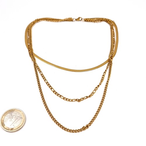 186 - An 18 carat gold plated three strand necklace.