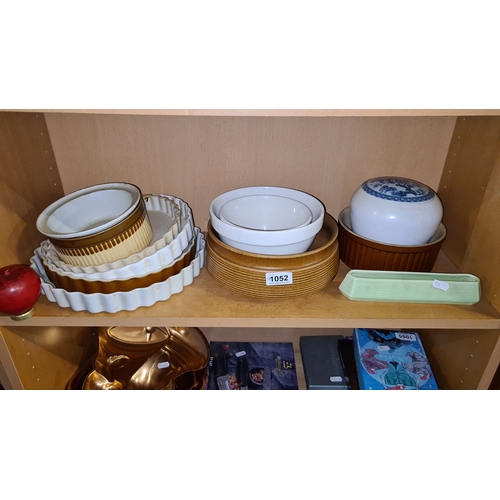 1052 - Group of assorted kitchen ceramics, including ribbed stoneware casserole dishes, two white Mason Cas... 