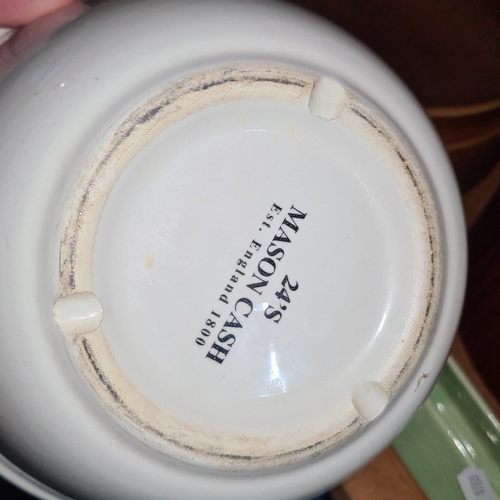 1052 - Group of assorted kitchen ceramics, including ribbed stoneware casserole dishes, two white Mason Cas... 