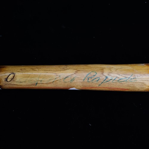 234 - A hand carved wooden ash baton inscribed 'Defence Rapido'. Please note, the image of the modelled it... 