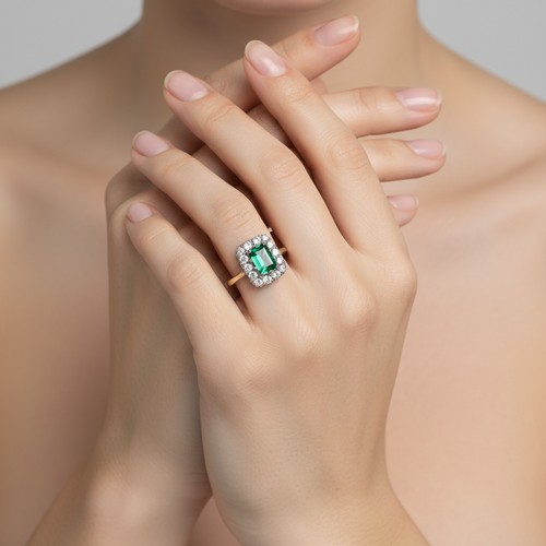 Star Lot : A nine carat gold / Silver gemset ring. One surround stone ...