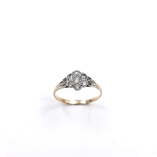 Star Lot: A very Pretty White Topaz Daisy ring set in Platinum. Stamped PLAT to inner shank. Size - P, Weight - 1.34 grams.