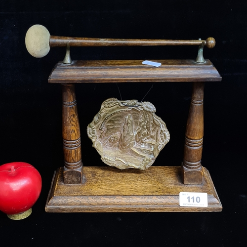 110 - A vintage wooden brass gong with brass center mount depicting a lovely mountainous village. Please n... 
