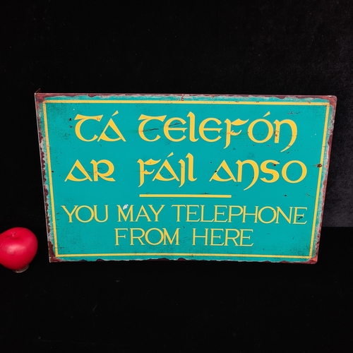 A printed metal double sided Irish telephone wall sign. Please note ...