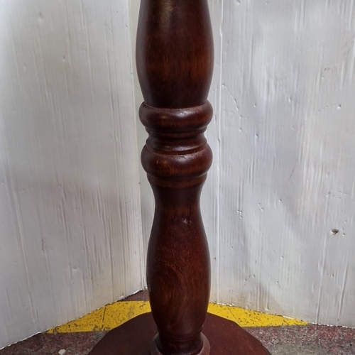 427 - A carved hardwood pedestal occasional table, the circular top and base with leaf-moulded gadrooned e... 