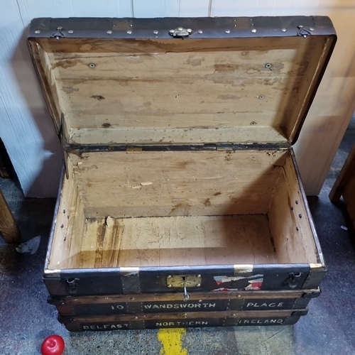 434 - Star Lot : An antique canvas-covered  travelling trunk with timber battens and brass studding, iron ... 