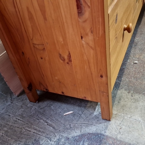 437 - A pine chest of nine drawers, the facade arranged with graduated drawers fitted with turned wooden k... 