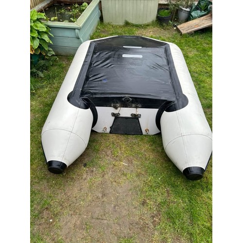 A YAM inflatables tender, model 230T, in blue and grey PVC with slatted ...