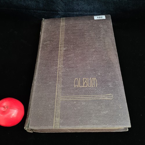 102 - Star Lot : A large postcard album holding a large array of vintage and antique postcards. Lot includ... 