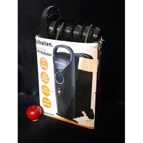 A Schallen 800W mini oil-filled radiator, 6-fin compact model with ...