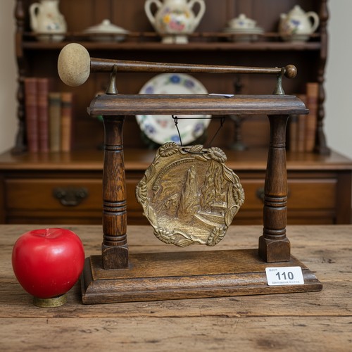 110 - A vintage wooden brass gong with brass center mount depicting a lovely mountainous village. Please n... 