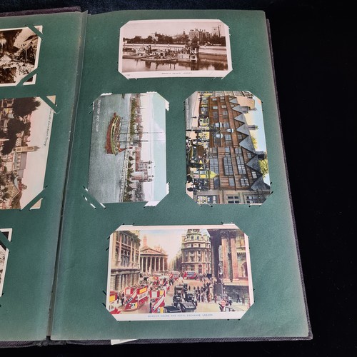 102 - Star Lot : A large postcard album holding a large array of vintage and antique postcards. Lot includ... 