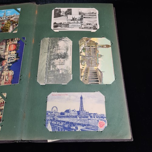 102 - Star Lot : A large postcard album holding a large array of vintage and antique postcards. Lot includ... 