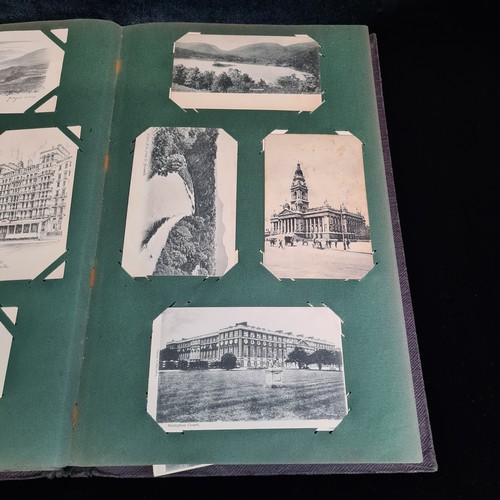 102 - Star Lot : A large postcard album holding a large array of vintage and antique postcards. Lot includ... 