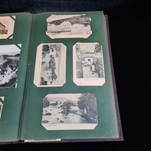 102 - Star Lot : A large postcard album holding a large array of vintage and antique postcards. Lot includ... 