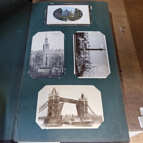 102 - Star Lot : A large postcard album holding a large array of vintage and antique postcards. Lot includ... 