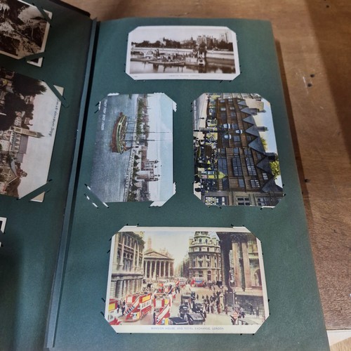 102 - Star Lot : A large postcard album holding a large array of vintage and antique postcards. Lot includ... 