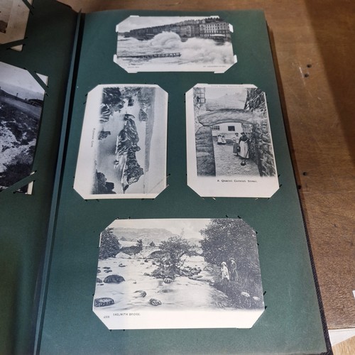 102 - Star Lot : A large postcard album holding a large array of vintage and antique postcards. Lot includ... 