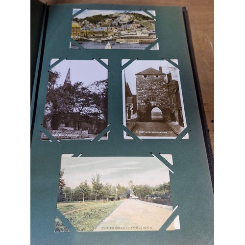 102 - Star Lot : A large postcard album holding a large array of vintage and antique postcards. Lot includ... 