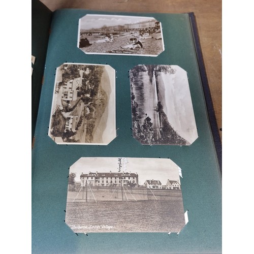 102 - Star Lot : A large postcard album holding a large array of vintage and antique postcards. Lot includ... 