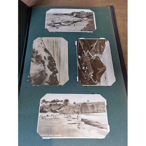 102 - Star Lot : A large postcard album holding a large array of vintage and antique postcards. Lot includ... 