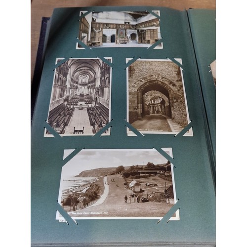 102 - Star Lot : A large postcard album holding a large array of vintage and antique postcards. Lot includ... 