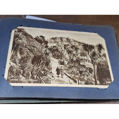 120 - A postcard album containing 100+ UK and Irish postcards. Examples  the 1920's - 40's  with hand writ... 