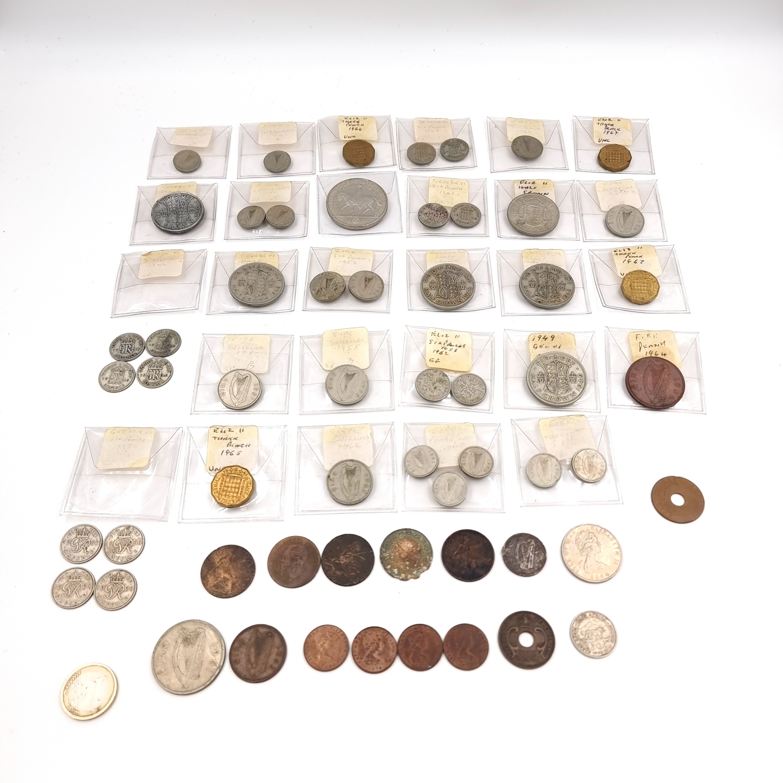 A collection of assorted coins including carded examples.
