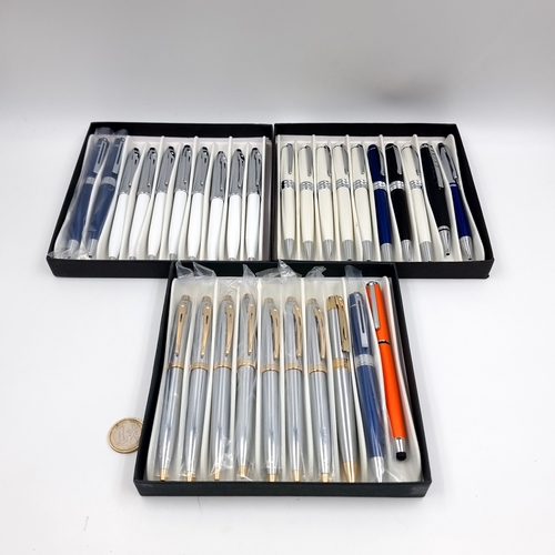 Three unopened boxes each containing 10 ball point pens.