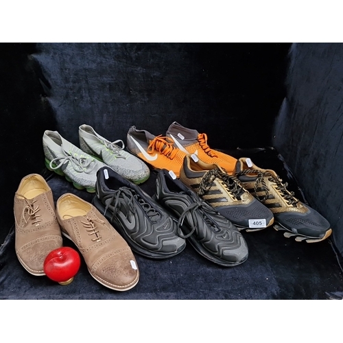 405 - A group of assorted footwear, comprising Nike Flyknit running shoes, Nike knit trainers, Adidas trai... 