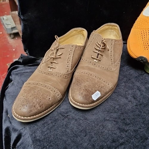 405 - A group of assorted footwear, comprising Nike Flyknit running shoes, Nike knit trainers, Adidas trai... 