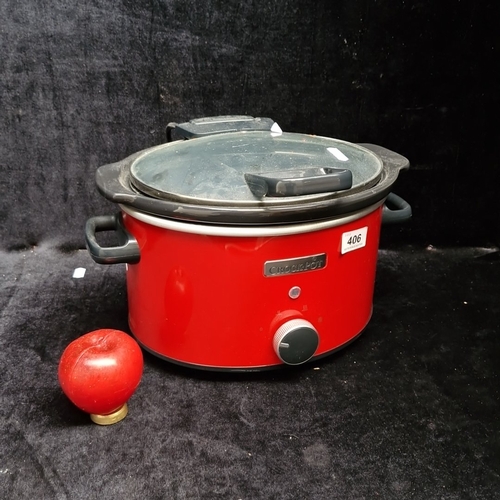 406 - A Crock-Pot electric slow cooker, model CSC037, in red with glass lid, removable ceramic insert, and... 