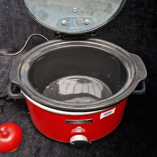 406 - A Crock-Pot electric slow cooker, model CSC037, in red with glass lid, removable ceramic insert, and... 