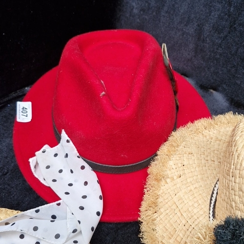 407 - A group of fashion hats, including felt and woven paper styles, comprising a red fedora, straw sunha... 