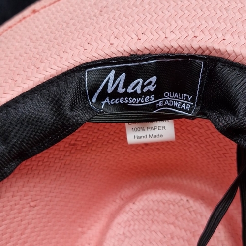 407 - A group of fashion hats, including felt and woven paper styles, comprising a red fedora, straw sunha... 