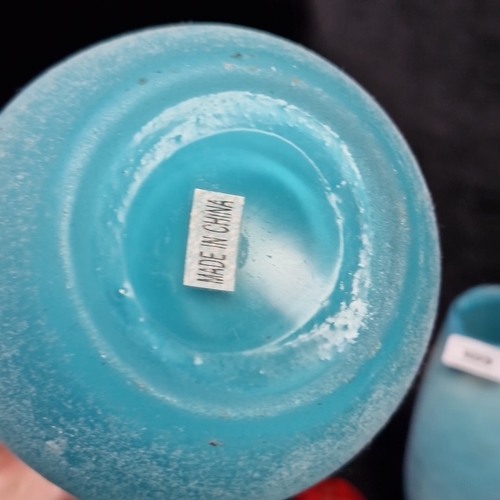 409 - 2 frosted turquoise glass vases, of teardrop form with slightly everted rims, each bearing a paper l... 