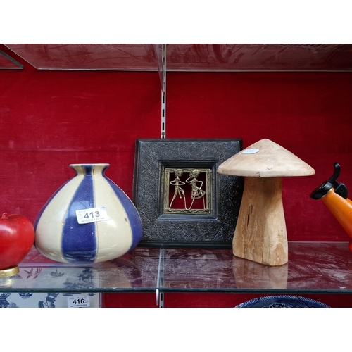 413 - A group of decorative objects, including a blue-and-cream striped glazed ceramic vase, a carved wood... 